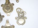 five different types of metal items on a white surface