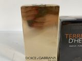 the box of the perfume is next to the box of the perfume