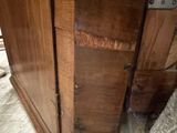 a wooden cabinet with a metal latch on it