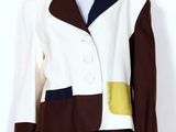 a white and brown jacket and skirt with a brown and white jacket on a mannequin mannequin mannequin mannequin mannequin manne