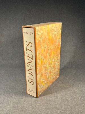 an image of a book with a yellow cover sitting on a gray surface
