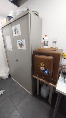 an image of a refrigerator in a small room