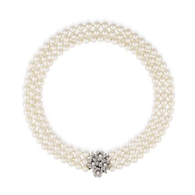 a three strand pearl necklace with a diamond clasp