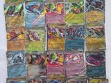 a pile of pokemon cards sitting on top of a table