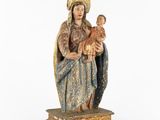a statue of a woman holding a baby in her arms