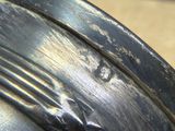 a close up of a motorcycle tire with rust on it