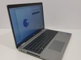 an open laptop computer sitting on top of a white table