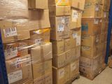 many boxes stacked on top of each other in a warehouse