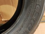 tire tread of a car on a cardboard box with a cardboard box in the background