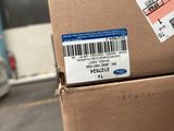a cardboard box with a barcode on it in a warehouse