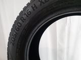 a close up of a tire on a white surface