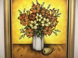 un tableau de fleurs dans un vase sur le mur