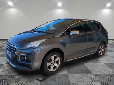 a picture of a gray car parked in a garage
