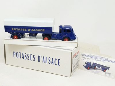 two toy trucks that are sitting on top of a box
