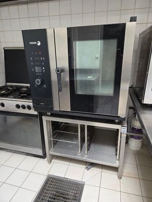 two ovens and a microwave in a kitchen