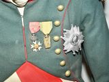 a man in a military uniform with medals on his chest