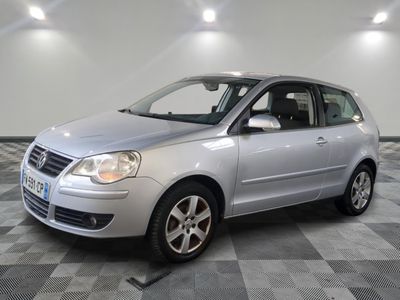 a picture of a silver car parked in a garage