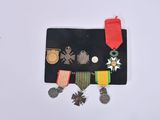 an assortment of medals and medals are displayed on a white surface