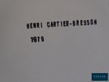 a close up of a piece of paper with the words henri cartier - bresson written on it