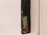 a door handle that has a rusted paint on it