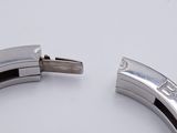 a close up of a metal bracelet with a clasp on it