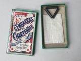an old matchbox with a cigarette in it sitting on a table