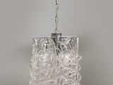 a clear glass chandelier hanging from the ceiling