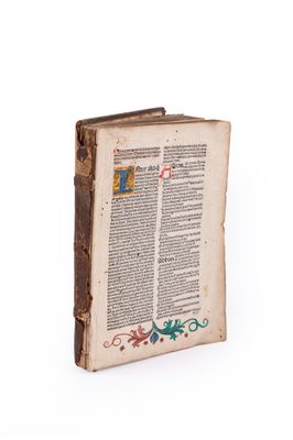 an old book with a decorative design on the cover