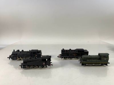 three toy trains that are sitting on a table