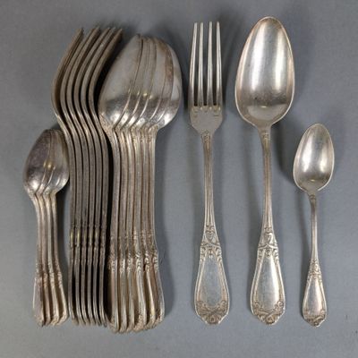 a lot of silver spoons and spoons on the table
