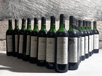 several bottles of wine are lined up in a row on a table