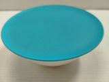 a blue and white bowl sitting on a white table