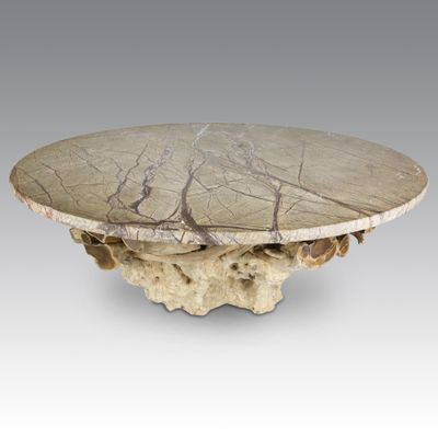 a white marble table with a tree on top