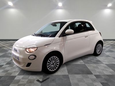 a picture of a small white car parked in a garage