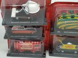 four toy cars that are in a display case