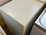 a washer and a dryer in a small room