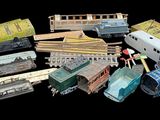 many different types of toy trains on a black background