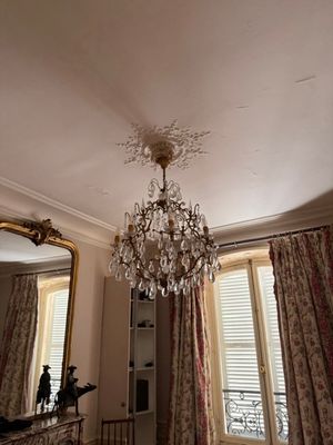 a chandelier hanging from the ceiling in a room
