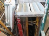 a pile of wood and metal items in a room