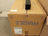 a box with a remote on top of it next to a cardboard box
