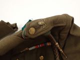 a close up of a military uniform with a badge on it