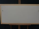 a picture of a white board on a wooden easel
