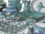 a large collection of blue and white dishes and plates