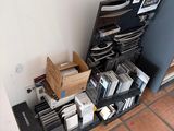 a lot of electronic equipment on the floor next to the wall