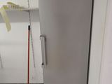 an image of a refrigerator in a kitchen with the door open