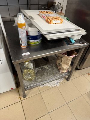 a counter with a cutting board on it in a kitchen