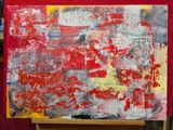 une peinture abstraite dans les tons de rouge et de jaune sur fond rouge