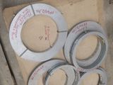 four pieces of duct tape sitting on top of a pallet