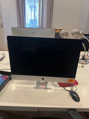 a desk with a laptop and a monitor on it