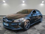 a black mercedes cla parked on a checkered floor